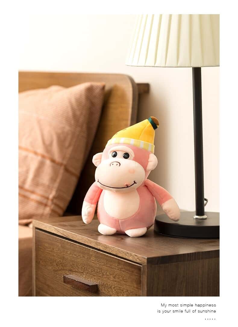 Peluche Gorille Rose Bonnet Jaune