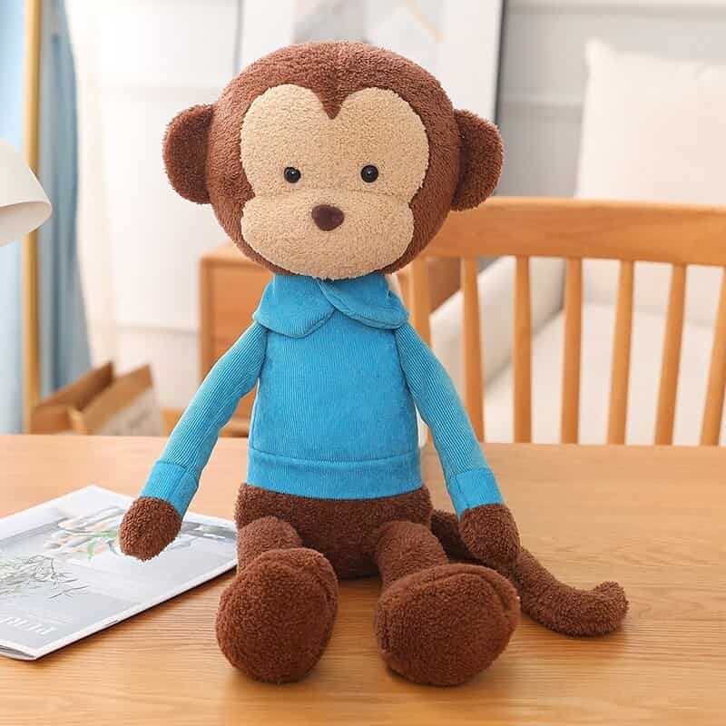 Peluche Singe Marron Pull Bleu Assis