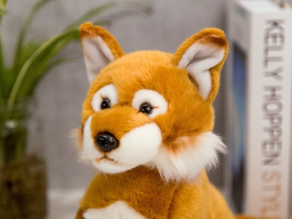 Doudou Renard Roux Assis